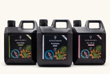 Three Grounded natural liquid soap containers made with plant-based ingredients